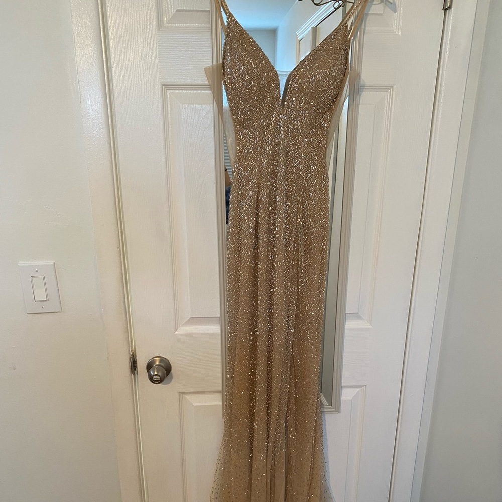 Women’s formal Gown. Used, worn once. Interior lower fabric has worn damage